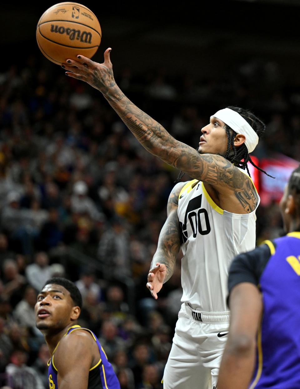 Utah Jazz guard Jordan Clarkson (00) floats up a shot over Los Angeles Lakers forward Rui Hachimura (28) as Utah and Los Angeles play at the Delta Center in Salt Lake City on Saturday, Jan. 13, 2024. | Scott G Winterton, Deseret News