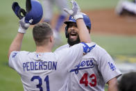 Los Angeles Dodgers Edwin Rios celebrates his home run with Joc Pederson against the Atlanta Braves during the first inning in Game 3 of a baseball National League Championship Series Wednesday, Oct. 14, 2020, in Arlington, Texas. (AP Photo/Eric Gay)