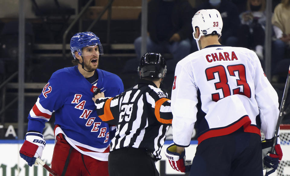 New York Rangers' Brendan Smith (42) has words for Washington Capitals' Zdeno Chara (33) during the second period of an NHL hockey game Wednesday, May 5, 2021, in New York. (Bruce Bennett/Pool Photo via AP)