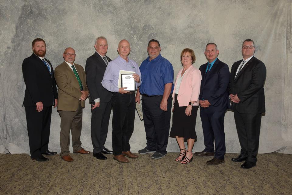 Ontario County Administrator Chris DeBolt, State Assemblyman Jeff Gallahan, Victor Town Supervisor Jack Marren, Director of Economic Development and Executive Director of Victor LDC Kathy Rayburn, Victor Village Deputy Mayor Mike Crowley and Vice President and Chief Development Officer for LSI Solutions Jim Guelzow (pictured) pose for a photo with 2022 Business of the Year recipients Bill Foster, CEO of BioWorks Inc. (fourth from left) and Director of Technical Services Peter Eppeira (fourth from right) of BioWorks Inc. at the Cobblestone Creek Country Club.