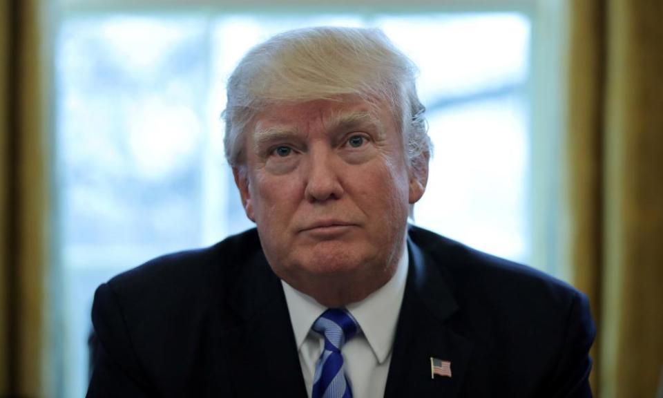 Donald Trump talks to journalists at the White House after the AHCA healthcare bill was pulled before a vote in Washington on 24 March 2017.