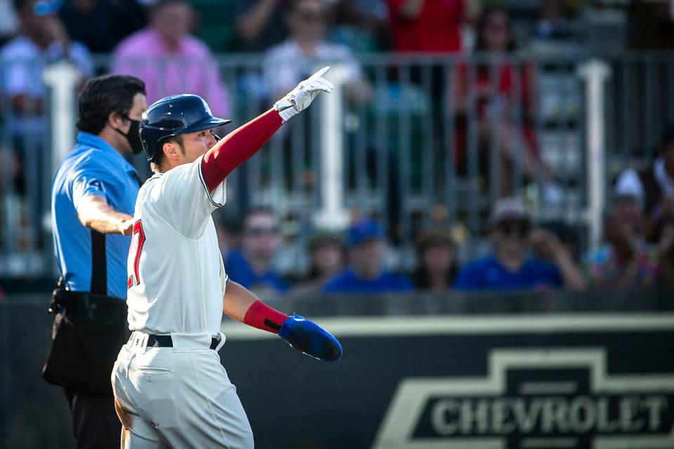 Chicago Cubs' Seiya Suzuki reacts after scoring a run during Thursday's Major League Baseball game against the Cincinnati Reds at the Field of Dreams in Dyersville.