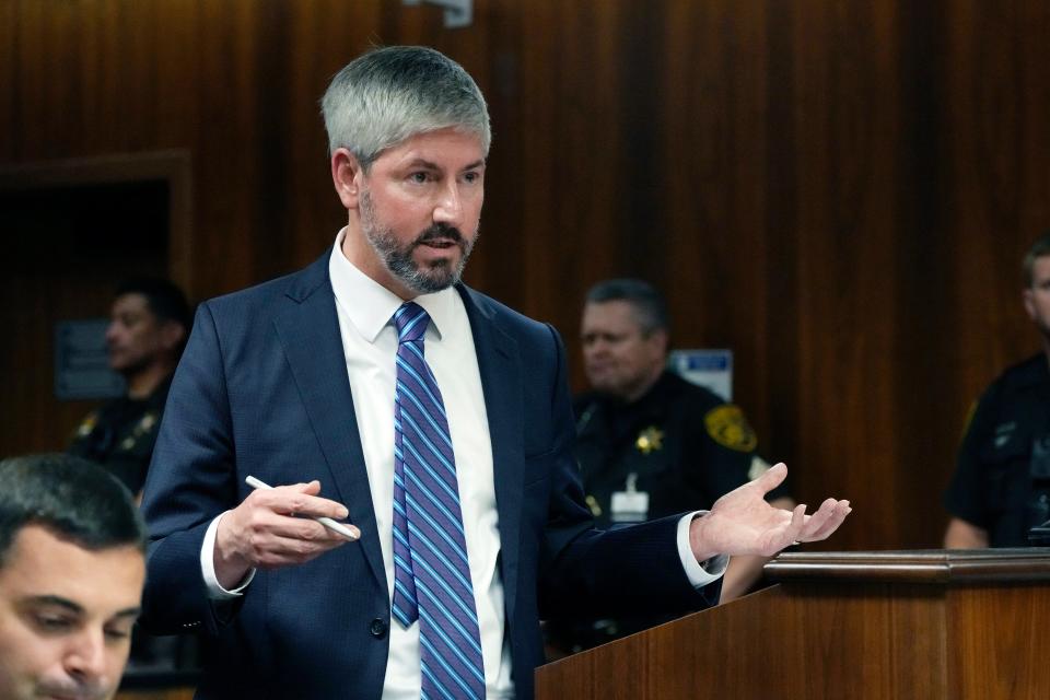 Prosecuting Attorney David Williams questions Dr. Kenneth Romanoski in court on Friday, July 28, 2023, in Pontiac, Mich. Prosecutors are making their case that the Michigan teenager, Ethan Crumbley, should be sentenced to life in prison for killing four students at his high school in 2021. Prosecutors introduced dark journal entries written by Crumbley, plus chilling video and testimony from a wounded staff member.