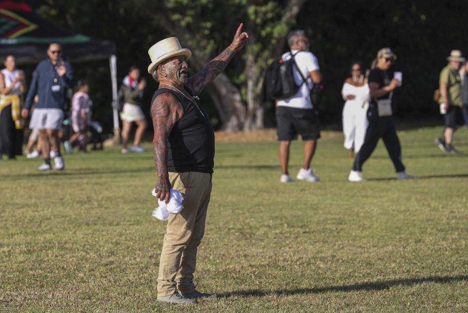 New Zealand Maori activist Tame Iti gestures at the Waitangi Treaty House grounds ahead of Waitangi Day celebrations in Waitangi, northern New Zealand, Monday, Feb. 5, 2024. In a fiery exchange at the birthplace of modern New Zealand, Indigenous leaders strongly criticized the current government's approach to Maori, ahead of the country’s national day.(Michael Cunningham/NZ Herald via AP)