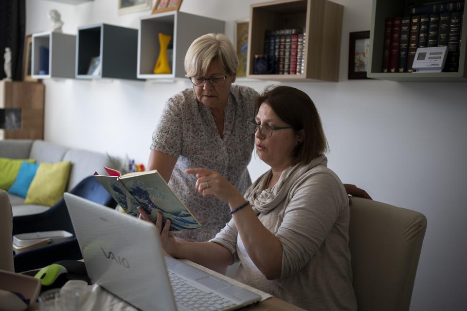 Eva Kozma and Eniko Pasztor prepare a speech for a demonstration against a factory to produce batteries for electric vehicles built by China-based Contemporary Amperex Technology Co. Limited (CATL) near Debrecen, Hungary on Tuesday, May 23, 2023. Residents, environmentalists and opposition politicians are worried that the factory will exacerbate existing environmental problems and use up the country's precious water supplies. (AP Photo/Denes Erdos)