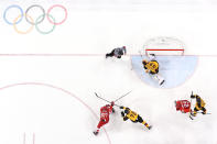 <p>Nikita Gusev #97 of Olympic Athlete from Russia shoots and scores against Dominik Kahun #72 and Danny Aus Den Birken #33 of Germany in the third period during the Men’s Gold Medal Game on day sixteen of the PyeongChang 2018 Winter Olympic Games at Gangneung Hockey Centre on February 25, 2018 in Gangneung, South Korea. (Photo by Bruce Bennett/Getty Images) </p>