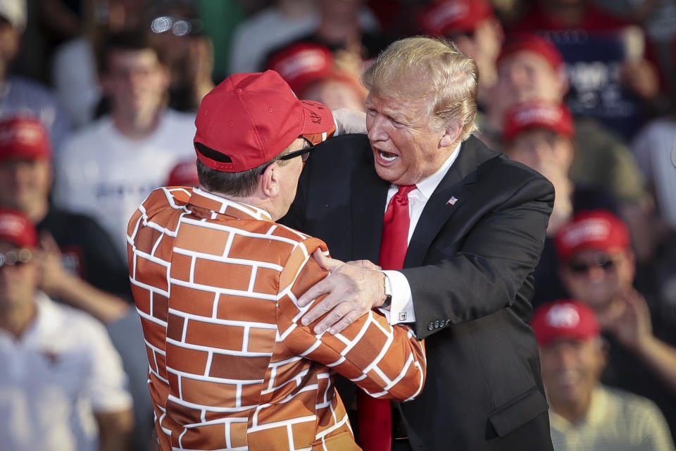 MONTOURSVILLE, PA - MAY 20: U.S. President Donald Trump calls up Blake Marnell, wearing a jacket with bricks representing a border wall, to the stage during a 'Make America Great Again' campaign rally at Williamsport Regional Airport, May 20, 2019 in Montoursville, Pennsylvania. Trump is making a trip to the swing state to drum up Republican support on the eve of a special election in Pennsylvania's 12th congressional district, with Republican Fred Keller facing off against Democrat Marc Friedenberg. (Photo by Drew Angerer/Getty Images)