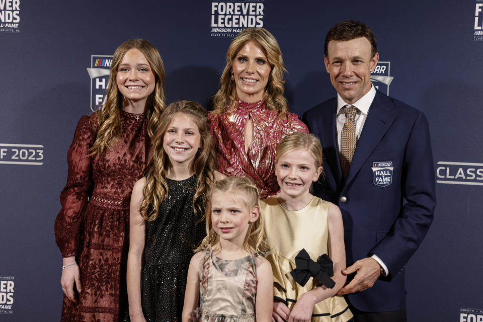 Matt Kenseth poses with his family as he arrives for the NASCAR Hall of Fame inductions in Charlotte, N.C., Friday, Jan. 20, 2023. (AP Photo/Nell Redmond)