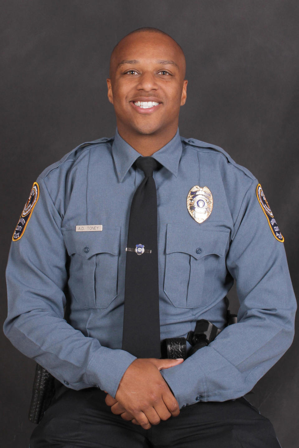This undated photo provided by the Gwinnett County Police Department on Saturday, Oct. 20, 2018 shows Officer Antwan Toney. On Saturday, Toney was killed after being shot while responding to a suspicious vehicle parked near a middle school. (Gwinnett County Police Department via AP)