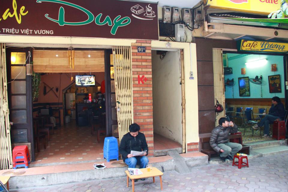 In this photo taken Jan. 5, 2013, customers drink coffee on Trieu Viet Vuong Street in Hanoi, Vietnam. Starbucks announced Thursday Jan. 3, it would enter Vietnam in early February with a cafe in Ho Chi Minh City. But the Seattle-based company faces a unique market in Vietnam, where French-inspired coffee culture reigns supreme; two homegrown chains have established presences; and family-run sidewalk cafes are as ubiquitous as noodle shops. (AP Photo /Mike Ives)