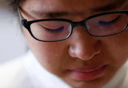 Miwa Moriya cries while she speaks during an interview with Reuters at her house in Yokohama, Japan, April 24, 2019. REUTERS/Kim Kyung-hoon