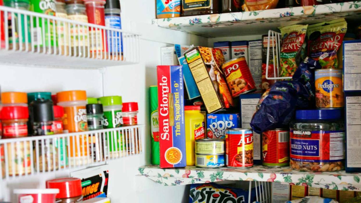 Full white pantry with wire baskets