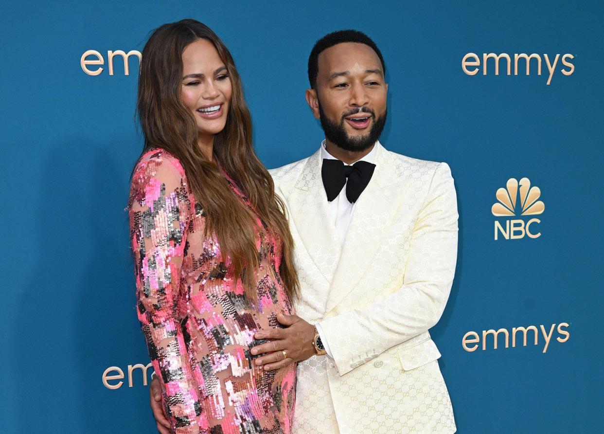John Legend(R) and Chrissy Teigen arrive for the 74th Emmy Awards at the Microsoft Theater in Los Angeles, California, on September 12, 2022. (Photo by Robyn BECK / AFP) (Photo by ROBYN BECK/AFP via Getty Images)
