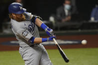 Los Angeles Dodgers' Justin Turner his a home run against the Tampa Bay Rays during the first inning in Game 4 of the baseball World Series Saturday, Oct. 24, 2020, in Arlington, Texas. (AP Photo/Eric Gay)