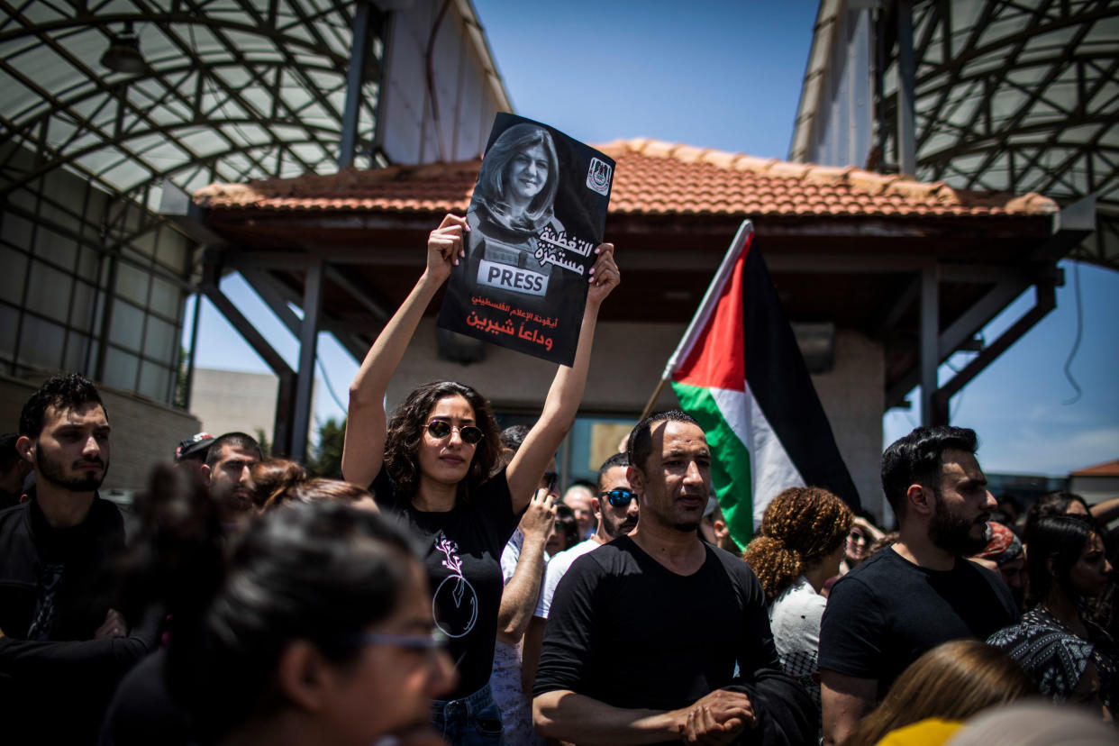 Palestinians attend the state funeral of Al Jazeera reporter Shireen Abu Akleh