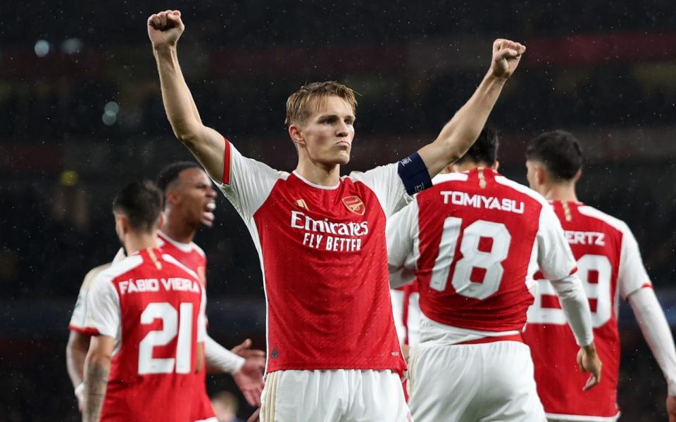 Martin Odegaard celebrates scoring Arsenal's fourth goal against PSV in the Champions League