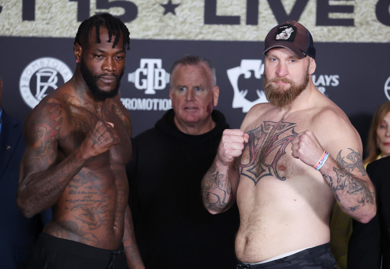 BROOKLYN, NEW YORK - OCTOBER 14:  Deontay Wilder  and Robert Helenius pose during their weigh in at Barclays Center on October 14, 2022 in Brooklyn, New York.  The bout will be a WBC Heavyweight Title Eliminator fight  taking place at Barclays Center on October 15, 2022 in Brooklyn, New York. (Photo by Al Bello/Getty Images)