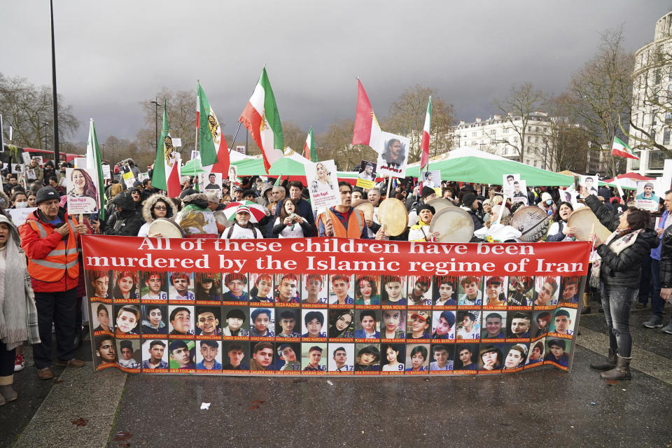 Protesters gather at Marble Arch before they march to Trafalgar Square to protest against the Islamic Republic in Iran following the death of Mahsa Amini, in London, Sunday, Jan. 8, 2023. (Jonathan Brady/PA via AP)