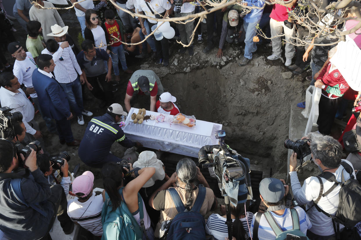 Family members bury 7-year-old murder victim Fatima in Mexico City, Tuesday, Feb. 18, 2020. Fatima's body was found wrapped in a bag and abandoned in a rural area on Saturday. Five people have been questioned in the case, and video footage of her abduction exists. (AP Photo/Marco Ugarte)