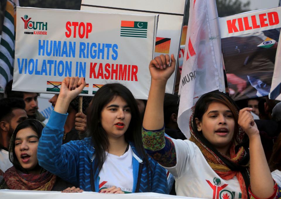 Members of Youth Forum for Kashmir chant anti India slogans during a demonstration to mark International Human Rights Day, in Lahore, Pakistan, Tuesday, Dec. 10, 2019. Protesters chanted slogans against the Indian government to condemn violence against Indian Kashmiris who are resisting Indian rule. (AP