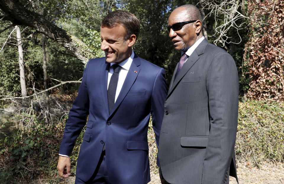 French President Emmanuel Macron, left, welcomes Guinean President Alpha Conde for a ceremony marking the 75th anniversary of the WWII Allied landings in Provence, in Saint-Raphael, southern France, Thursday, Aug. 15, 2019. Starting on Aug. 15, 1944, French and American troops — 350,000 in total — landed on the French Riviera. U.S. forces drove north while French troops — many from French colonies in Africa — moved along the coast to secure key ports. (Eric Gaillard/POOL via AP)