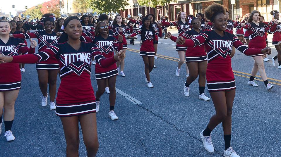 The GROW Gadsden master plan calls for an update on school branding, attaching the “Titan” name to all middle schools in the Gadsden City system to promote unity. The Gadsden City High cheerleaders march down Broad Street during the Gadsden Veterans Day Parade in this Nov. 6, 2019, file photo.