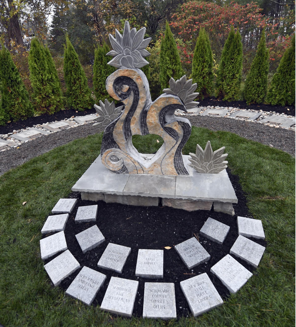 View of the Reflective Memorial before family members, friends and first responders gather for a memorial unveiling ceremony, on the one year anniversary of the Schoharie limousine crash that killed 20 people, Saturday, Oct. 5, 2019, in Schoharie, N.Y. The memorial featuring 20 stones in a semicircle is to be viewed privately by family members and first responders Saturday morning. The public is welcome Sunday. (AP Photo/Hans Pennink)