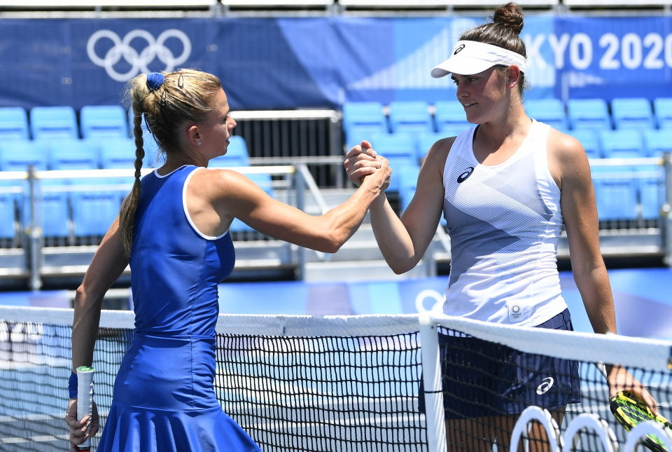 Brady shaking hands with her opponent after losing her match