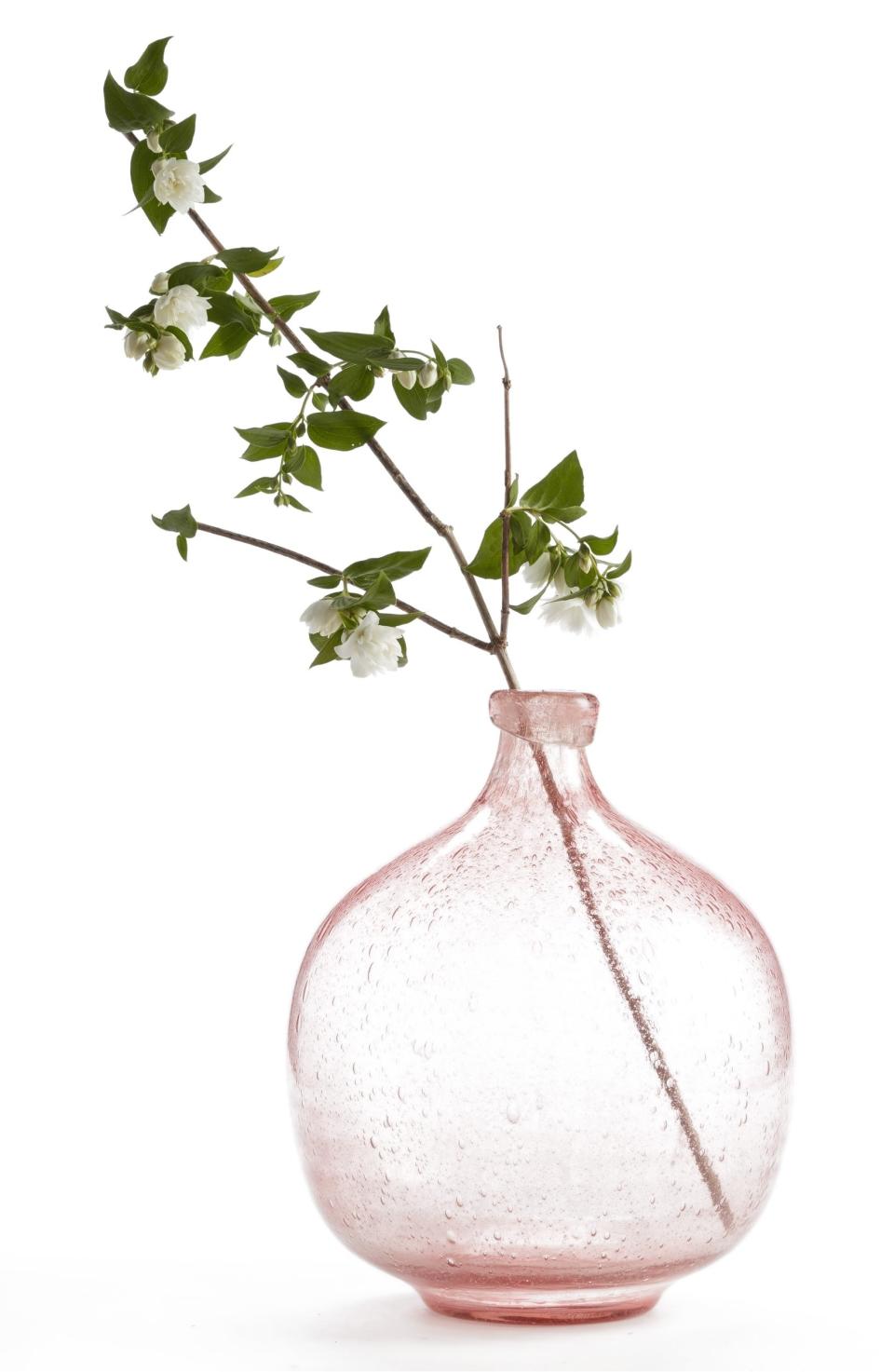 How to save on flower arrangements: Get a vase that only requires a single beautiful stem to wow everyone. <a rel="nofollow noopener" href="https://click.linksynergy.com/deeplink?id=FFSlEqCCN*I&mid=1237&murl=https://shop.nordstrom.com/s/treasure-bond-large-glass-vase/4775158" target="_blank" data-ylk="slk:SHOP NOW;elm:context_link;itc:0;sec:content-canvas" class="link ">SHOP NOW</a>: Large Glass Vase by Treasure & Bond, $26 $39