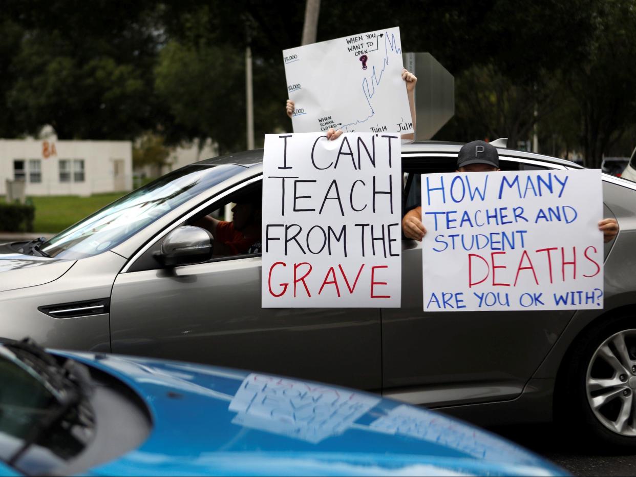 Florida teachers, whose unions are against their members returning to school, hold a car parade protest in front of the Pasco County School district office in Land O' Lakes, Florida, U.S. July 21, 2020.