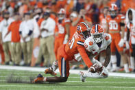 Syracuse defensive back Darian Chestnut (20) breaks up a pass intended for Clemson wide receiver Joseph Ngata (10) during the third quarter of an NCAA football game in Syracuse, N.Y., Friday, Oct. 15, 2021. (AP Photo/Joshua Bessex)