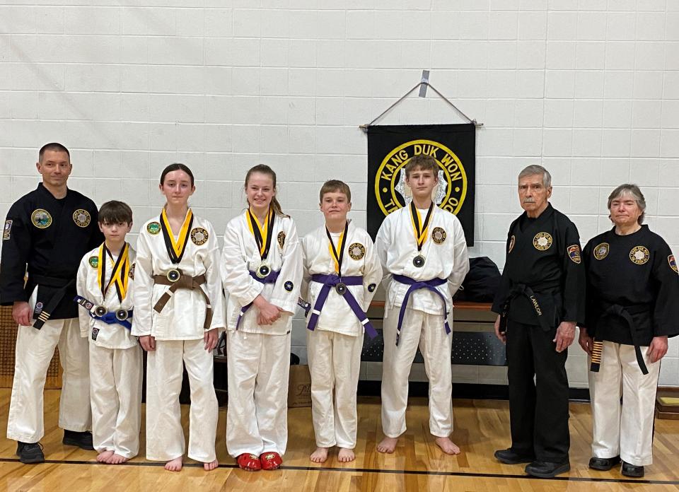 Several Granville students successfully competed earlier this month in the the annual American Kang Duk Won International Karate Championships at Watertown, New York. From left are Jeremy Hopping (chief instructor), William Hopping, Grace Hopping, Maddie Bloomfield, Ryder Bloomfield, Cooper Shaw, Master Robert C. Lawlor (president) and Master Debbie Hintopoulos (director).