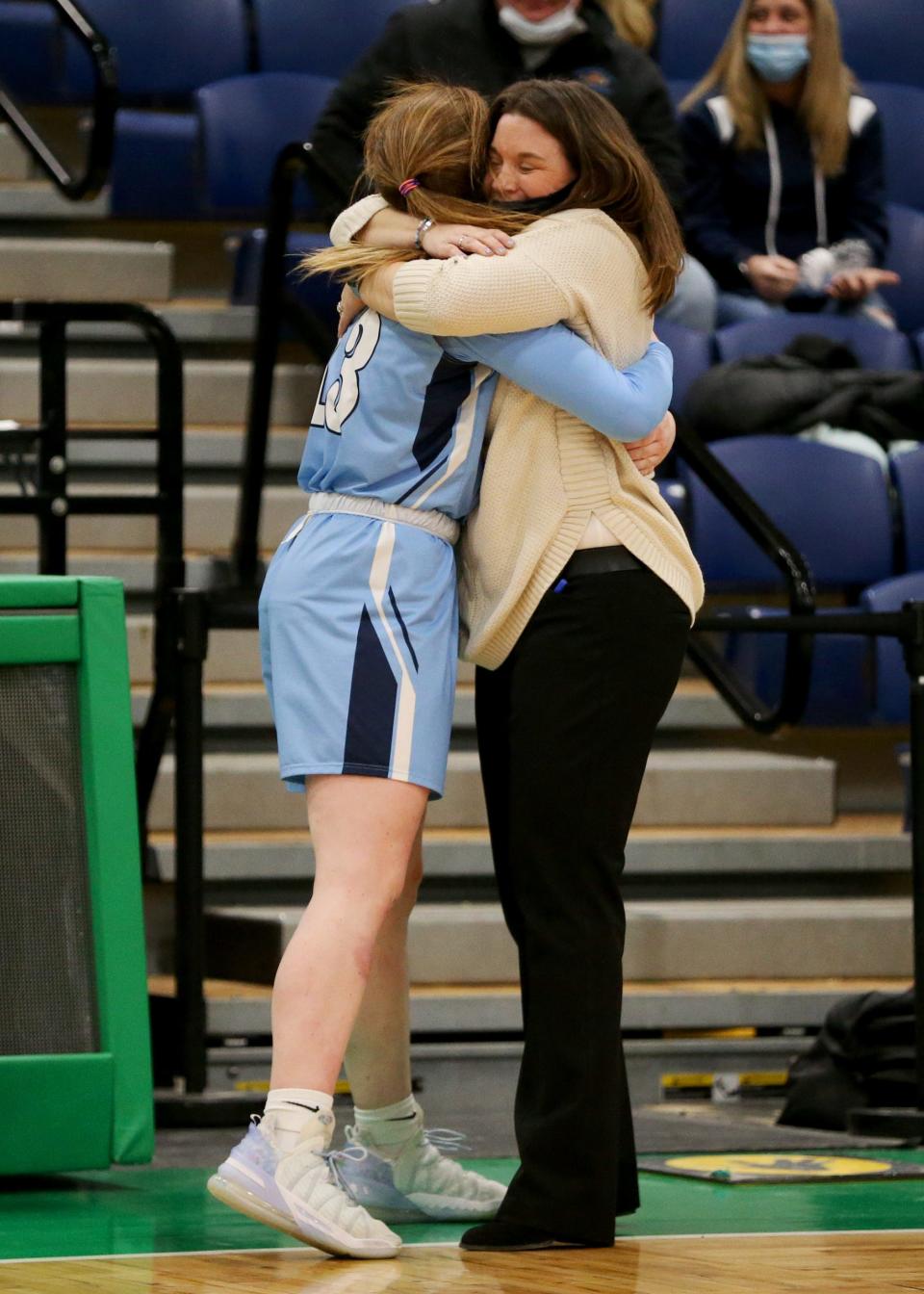 York High School girls basketball coach Jess Stacy, right, scored a 1,000 points and played with a shot clock in her career at Sharon High School in Massachusetts. She said it was strange to not have a shot clock when she began coaching in Maine.