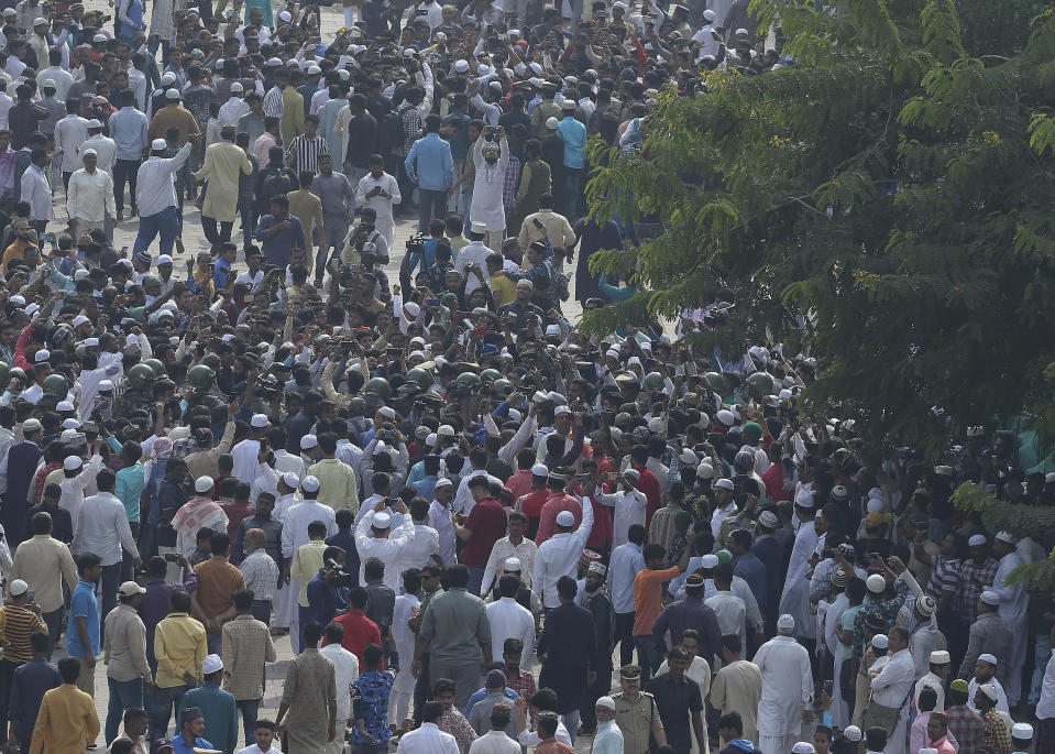 Indian Muslims shout slogans against the Citizenship Amendment Act after Friday prayers outside Mecca Masjid in Hyderabad, India, Friday, Dec. 20, 2019. Police banned public gatherings in parts of the Indian capital and other cities for a third day Friday and cut internet services to try to stop growing protests against a new citizenship law that have so far left eight people dead and more than 1,200 others detained. (AP Photo/Mahesh Kumar A.)