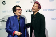 In this Wednesday, Oct. 16, 2019, photo tennis great and founder of the Women's Sports Foundation Billie Jean King, left, and soccer star Megan Rapinoe pose for photos on the red carpet of the Women's Sports Foundation's 40th annual Salute to Women in Sports in New York. Rapinoe, who was honored at the gala, won Sportswoman of the Year in the team category. She led the U.S. women's soccer team to victory at the World Cup in France and earned the FIFA Player of the Year award. (AP Photo/Mary Altaffer)