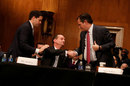 Alex Acosta, President Donald Trump's nominee to be Secretary of Labor, thanks Sen. Ted Cruz (R-TX) and Sen. Marco Rubio (R-FL) for introducing him during his confirmation hearing before the Senate Health, Education, Labor, and Pensions Committee on Capitol Hill in Washington, D.C., U.S. March 22, 2017. REUTERS/Aaron P. Bernstein