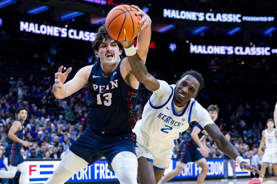 Kentucky forward Aaron Bradshaw (2) tries to get a rebound away from Penn forward Nick Spinoso (13) during Saturday’s game in Philadelphia.