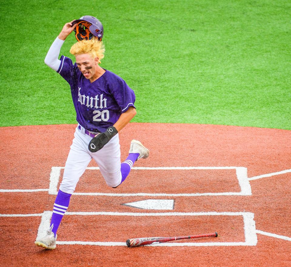 South's Brayden Blevins (20) celebrates scoring a run against East Central during the IHSAA semi-final sectional game at Bloomington High School South on Friday, May 27, 2022.