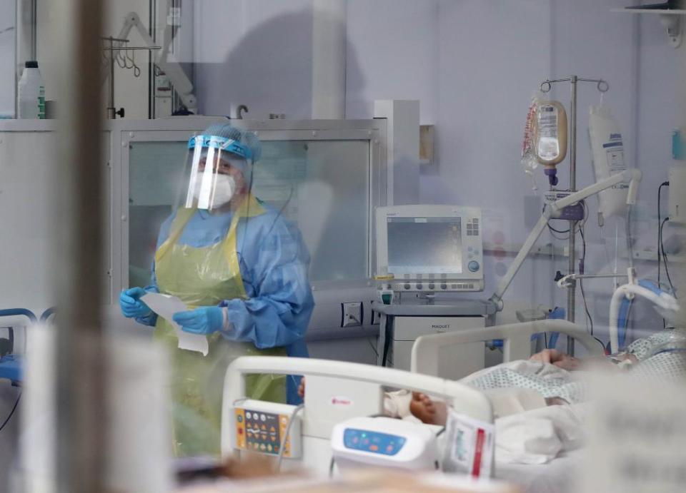 A member of the intensive care team treats Covid-19 patients at Craigavon Area hospital in Co Armagh, Northern Ireland.