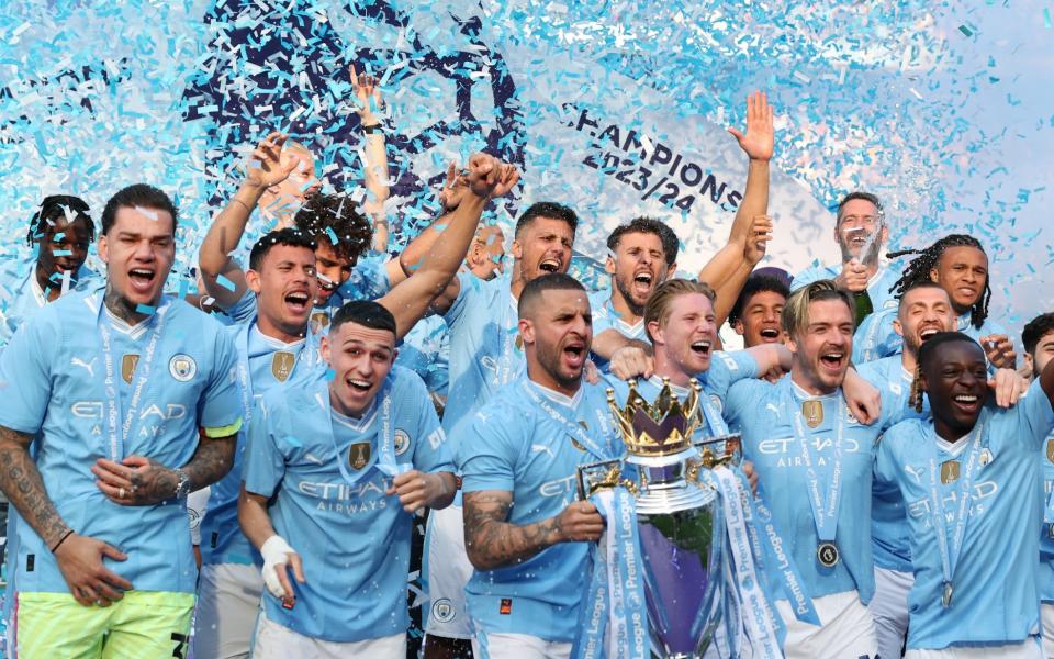 Man City with Premier League trophy