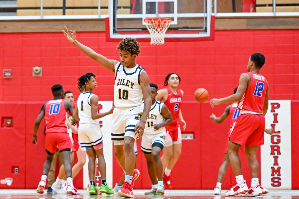 Riley's Marvin Schindler (10) reacts after a three point basket in the first half against Adams Tuesday, March 1, 2022, at Plymouth High School.