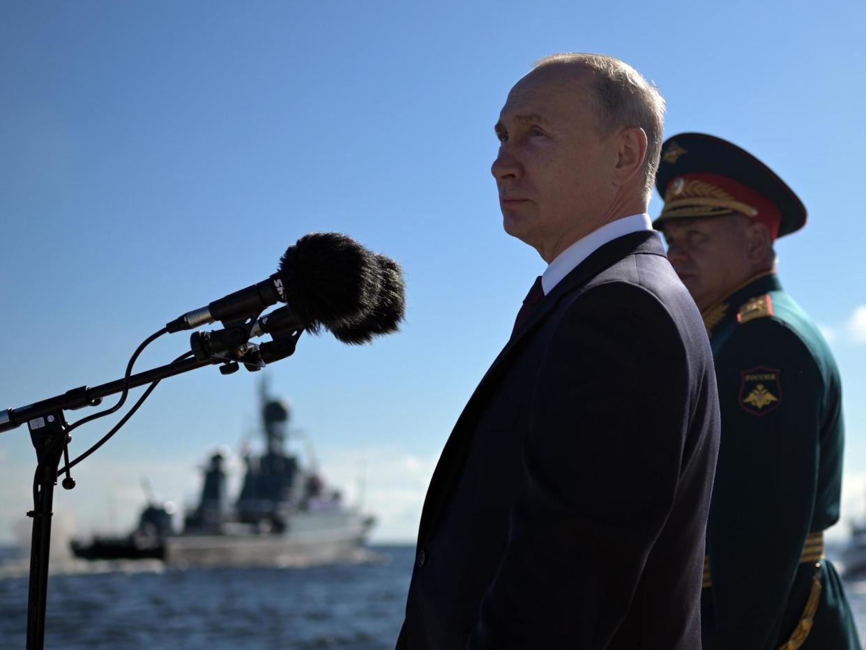 Russian president Vladimir Putin and defence minister Sergei Shoigu attend the 'Russia Navy Day' parade in St. Petersburg: EPA