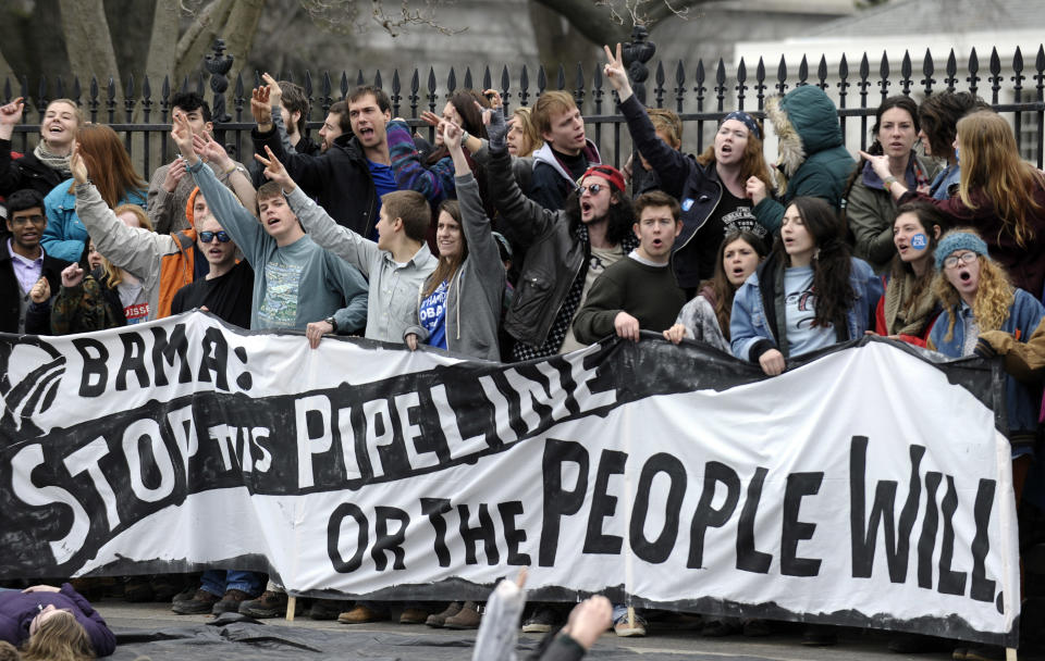 People protest against the XL Pipeline outside the White House in Washington, Sunday, March 2, 2014. (AP Photo/Susan Walsh)
