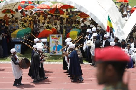 The coffins of Amhara president Mekonnen and two other officials who where killed in an attack are seen during a funeral ceremony in the town of Bahir Dar