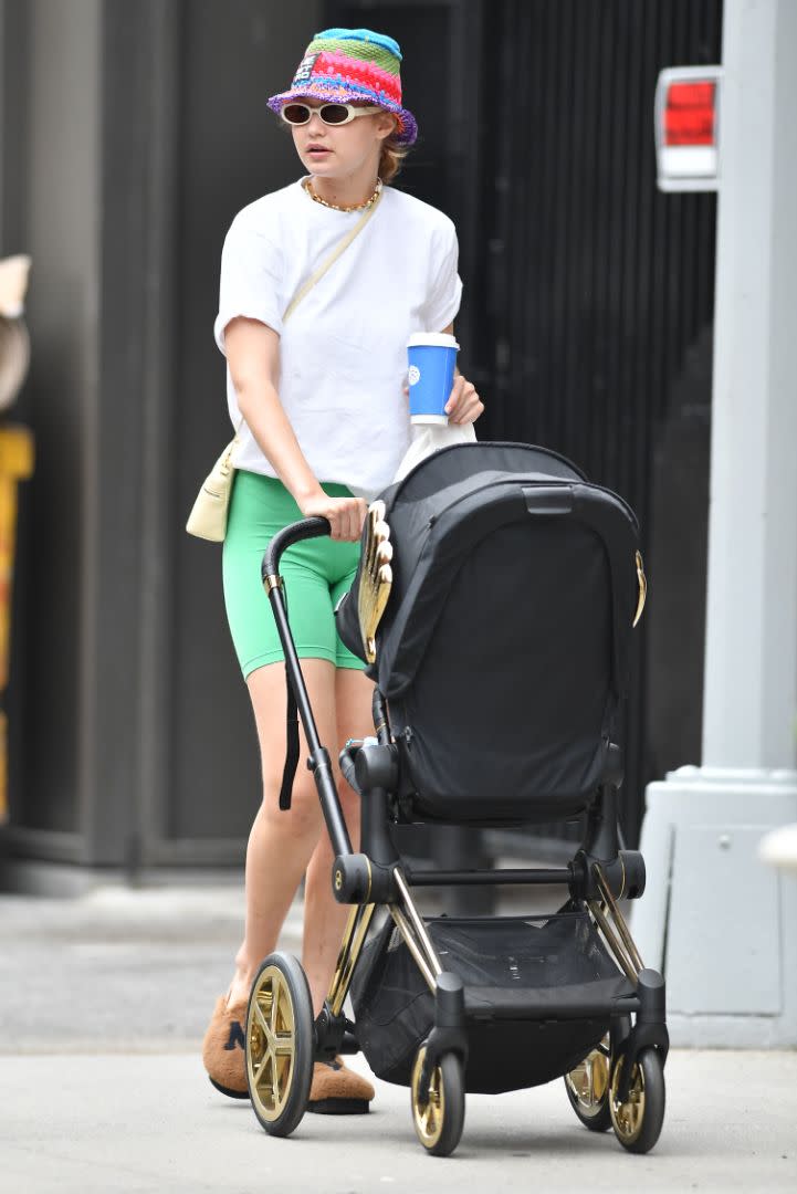 Gigi Hadid grabs Levain in New York during a walk with her daughter Khai and a friend, July 29. - Credit: Robert O'Neil/Splash News