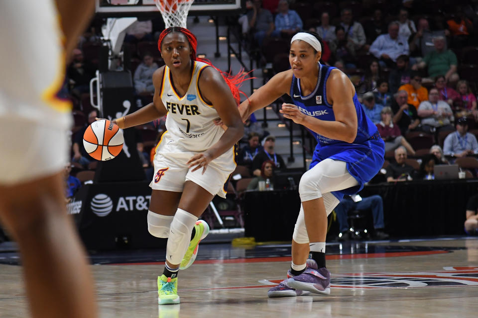 Indiana Fever forward Aliyah Boston handles the ball while defended by Connecticut Sun forward Brionna Jones on May 30, 2023, at Mohegan Sun Arena in Uncasville, Connecticut. (Erica Denhoff/Icon Sportswire via Getty Images)