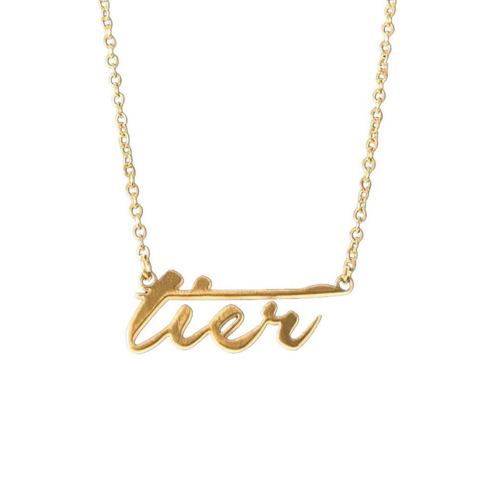 <p><strong>Tier</strong></p><p>shoptier.nyc</p><p><strong>$195.00</strong></p><p><a href="https://www.shoptier.nyc/shop-tier/p/tier-script-logo-nameplate-chain" rel="nofollow noopener" target="_blank" data-ylk="slk:Shop Now" class="link rapid-noclick-resp">Shop Now</a></p><p>Sweatsuits, hats, resort wear, and now, jewelry—Tier does it all. </p>