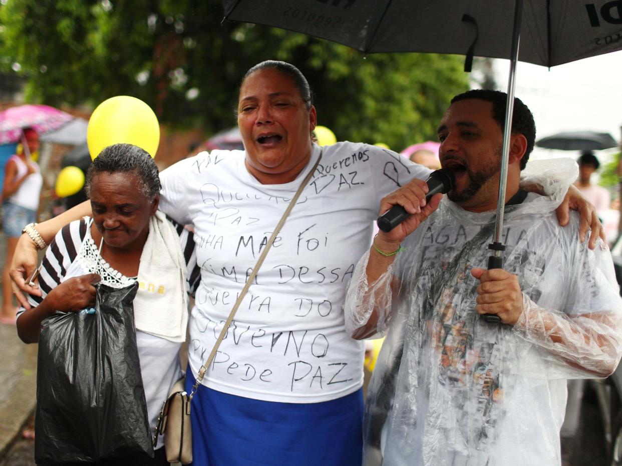 Residents of Complexo do Alemao march in protest over the death of eight -year-old Agatha Felix: REUTERS