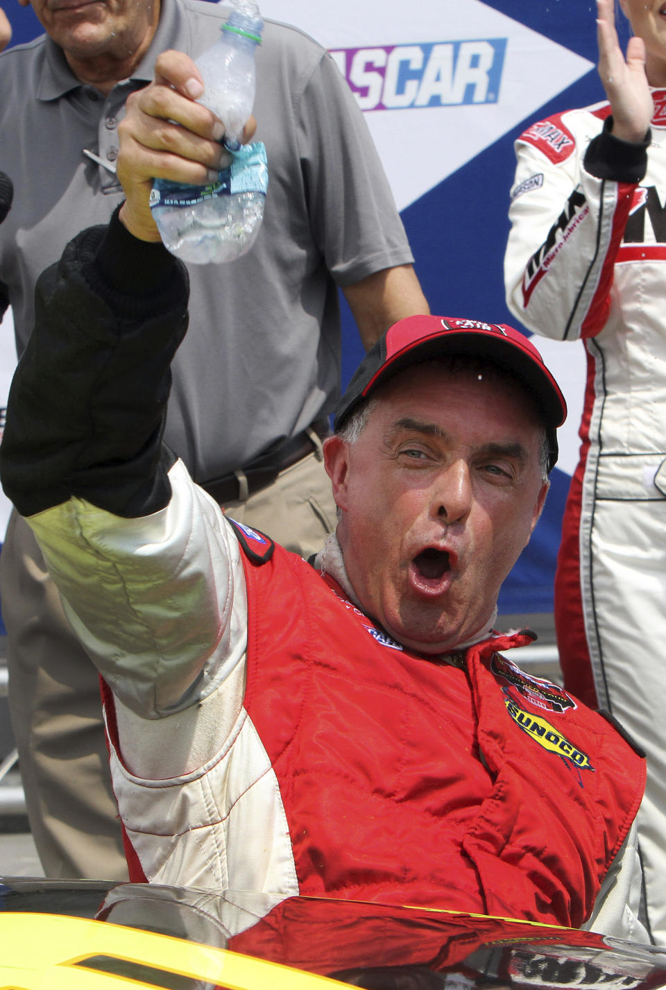 FILE - In this July 14, 2012, file photo, Mike Stefanik cheers after winning the NASCAR Whelen Modified Tour auto race at New Hampshire Motor Speedway in Loudon, N.H. The late Stefanik is a contender for NASCAR's 2021 Hall of Fame class, to be announced Tuesday, June 16, 2020. (AP Photo/Jim Cole, File)