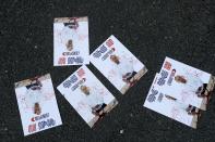 Leaflets reading "Hi Rob, killer of Armenians" lying on the asphalt during a parliamentary elections in Yerevan, Armenia, Sunday, June 20, 2021. Armenians are voting in a national election after months of tensions over last year's defeat in fighting against Azerbaijan over the separatist region of Nagorno-Karabakh. After casting his ballot, Robert Kocharyan called on authorities to investigate the appearance of leaflets denouncing him on Sunday, an apparent violation of the law banning campaigning on election day. (AP Photo/Sergei Grits)